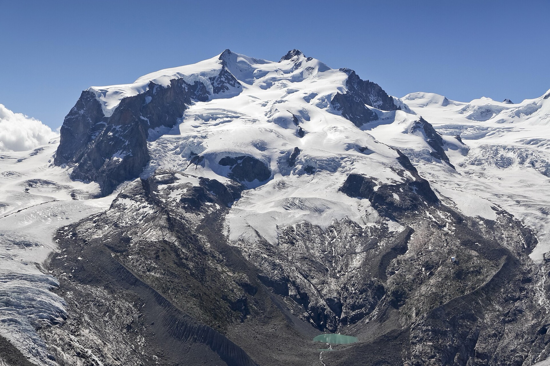Monte Rosa massif with its highest peak Dufourspitze (also: Monte Rosa), 4.634 m, and Monte Rosa Glacier as seen from Gornergrat in Wallis, Switzerland in 2012 August. The Dufourspitze is the highest mountain of Switzerland and regarding Europe, its height is exceeded only by the Mont Blanc.