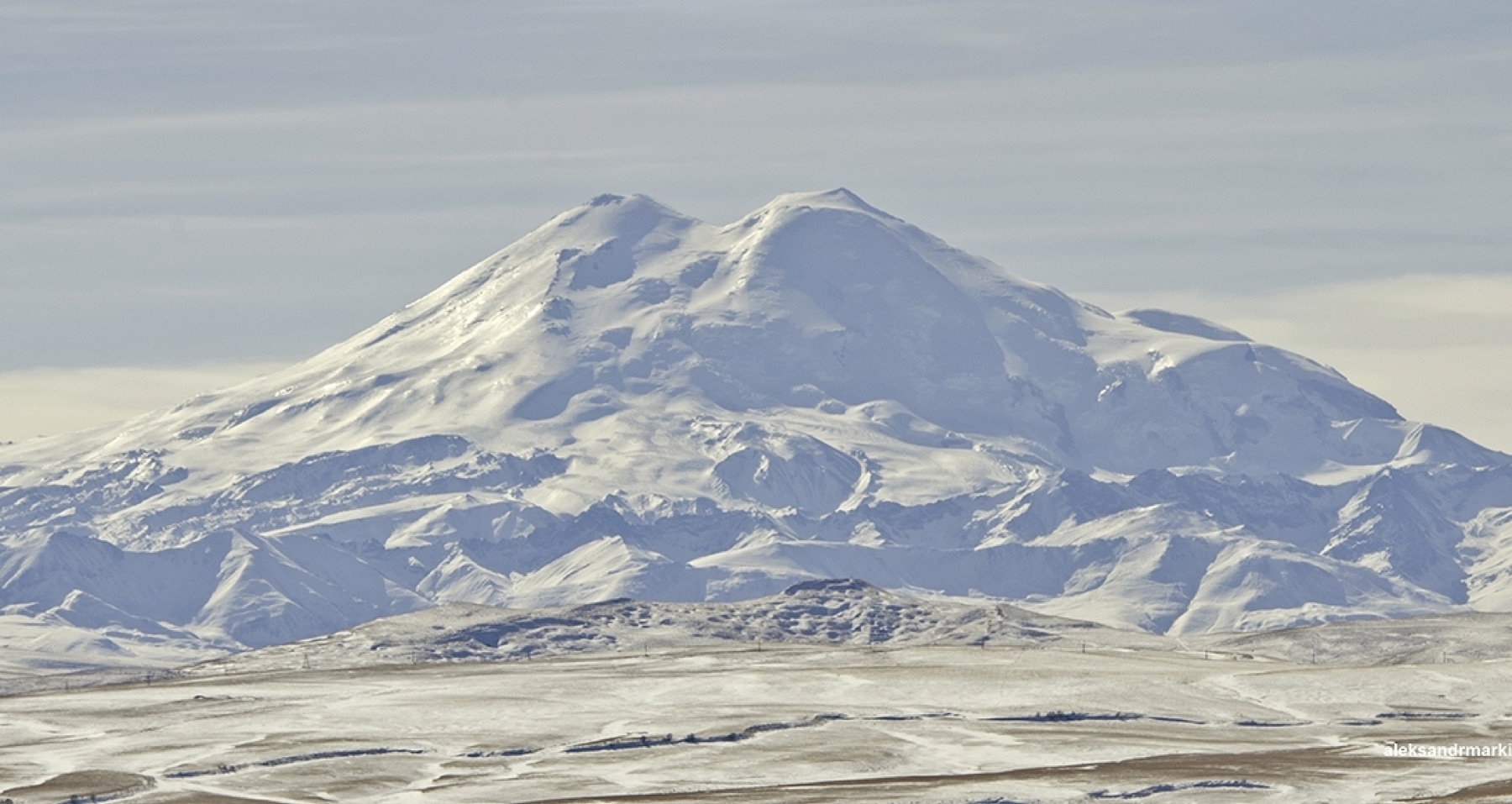 Glider Grob G 103 flying in front of Mount Elbrus.
