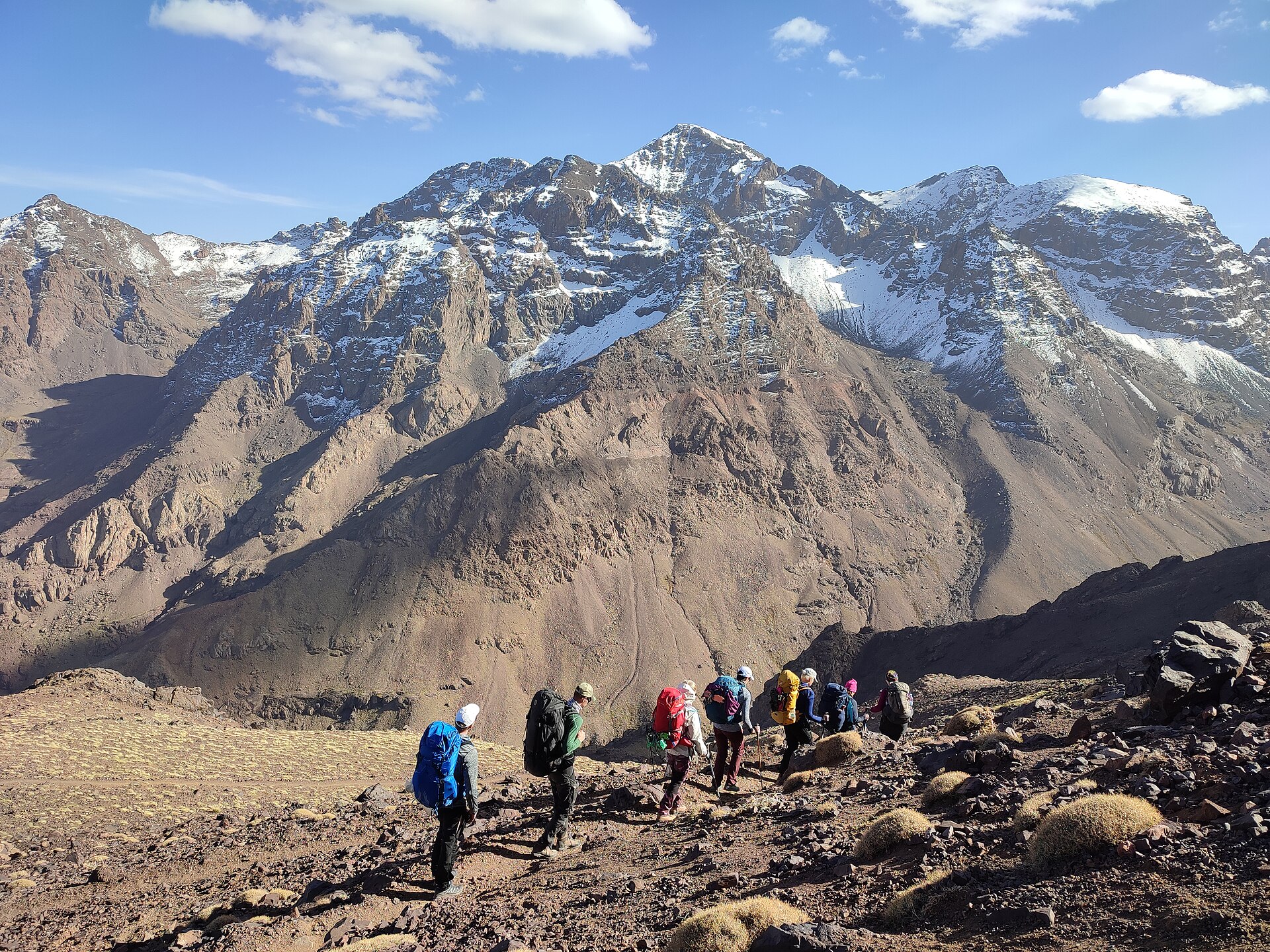 Jbel Toubkal above a group of hikers in the High Atlas